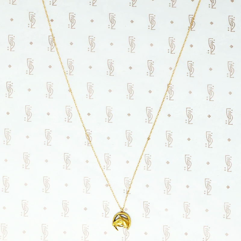 gold vintage horse in horseshoe pendant