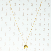 gold vintage horse in horseshoe pendant