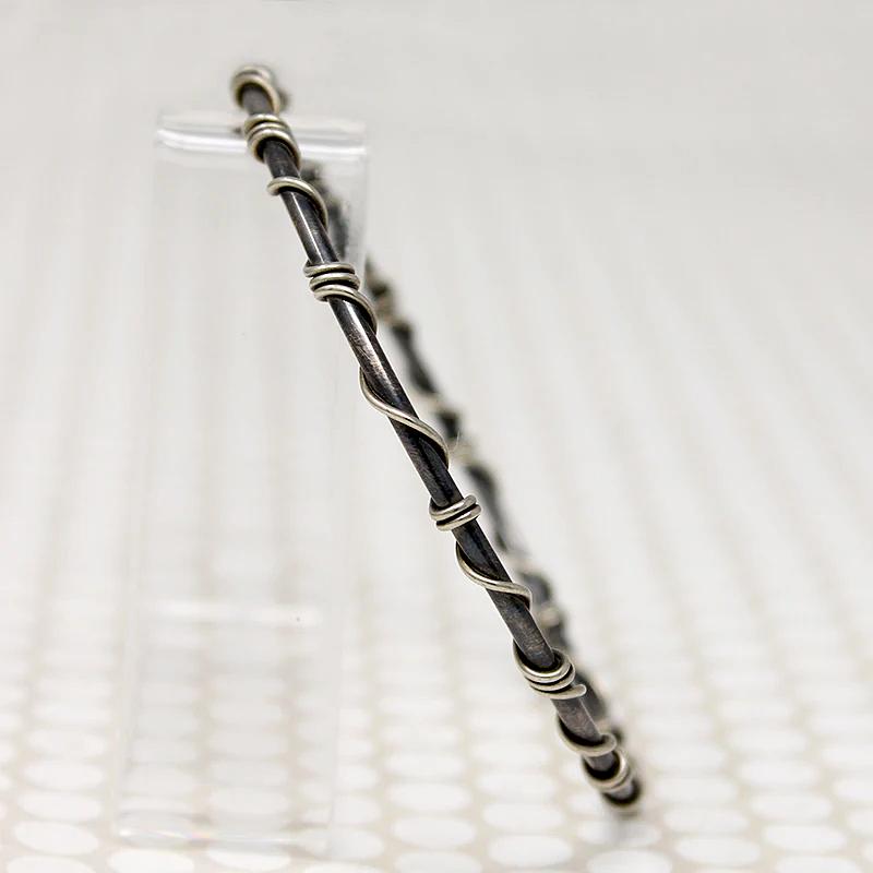 The Infinity Twist Silver Bangle from Allie B.