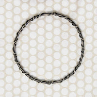 The Infinity Twist Silver Bangle from Allie B.