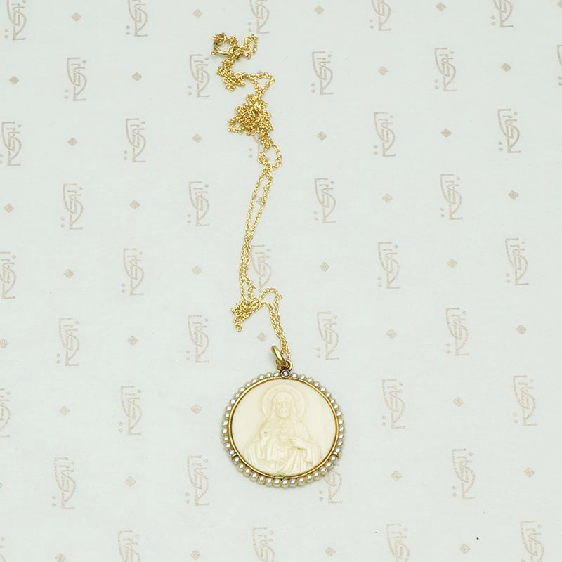 Carved Ivory Religious Pendant with Gold Pearls and Diamond, detail view.
