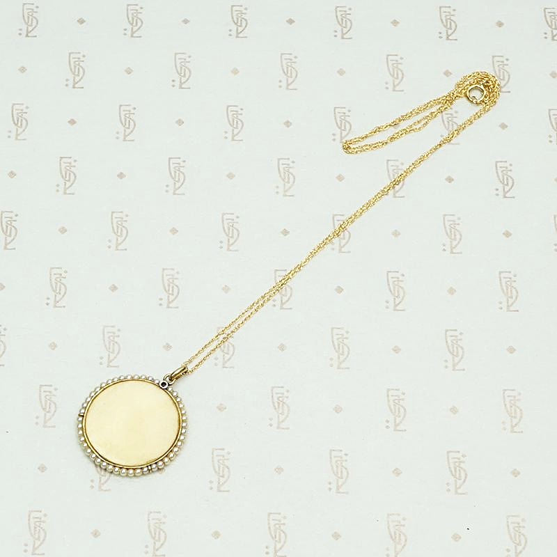 Carved Ivory Religious Pendant with Gold Pearls and Diamond, back view.