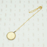 Carved Ivory Religious Pendant with Gold Pearls and Diamond, back view.