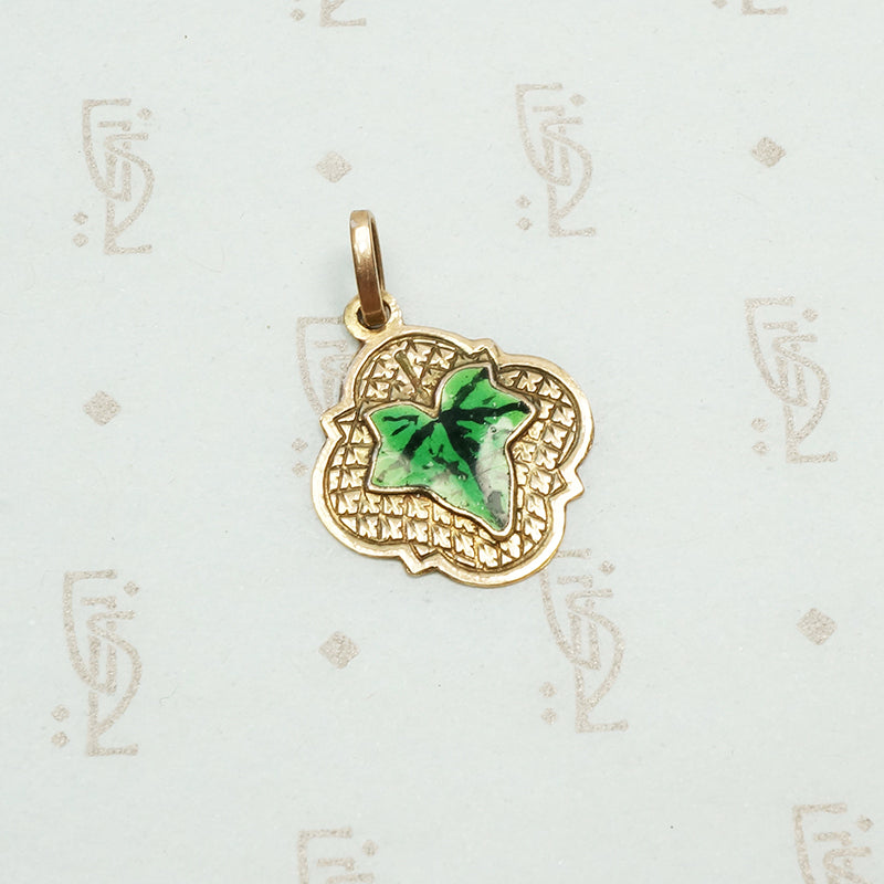realistically enameled ivy leaf on an embellished 14k rose gold pendant