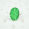 bright green carved jade set in 10k white gold ring