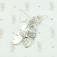 Silver Feather Earrings with Rock & Roll Vibes