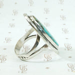 Serene Turquoise Ring with Rattlesnake Jaw Rockers