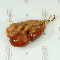 Plums and Cherries A Red Jade Carved Pendant