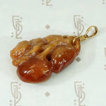 Plums and Cherries A Red Jade Carved Pendant