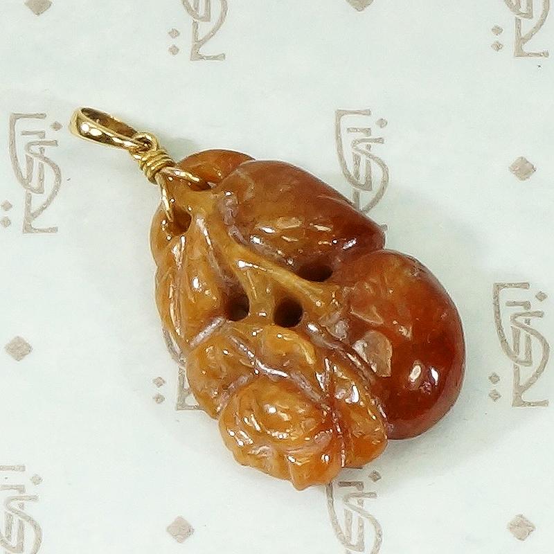 Plums and Cherries A Red Jade Carved Pendant