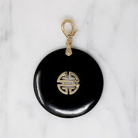 Inky Black Onyx Pendant with Gold Details