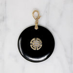 Inky Black Onyx Pendant with Gold Details