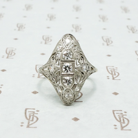art deco platinum knuckle ring with diamonds