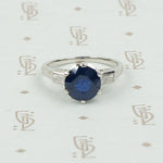 Intense Sapphire and Baguette Platinum Engagement Ring