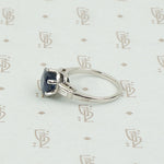Intense Sapphire and Baguette Platinum Engagement Ring
