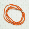 Delicate Two Strand Antique Red Coral Beads. Coiled view.
