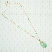 Carved Jade Plum Pendant on Decorative Gold Chain