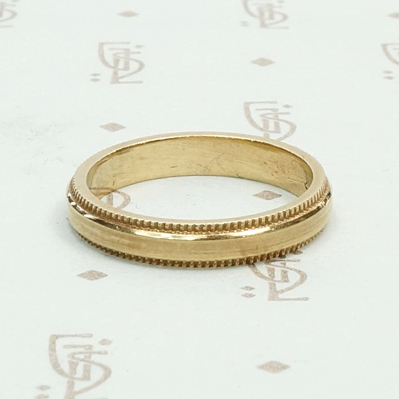 Heavy Vintage Gold Band with Sawtooth Edge, side view.