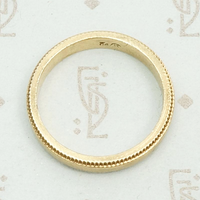 Heavy Vintage Gold Band with Sawtooth Edge, top view.
