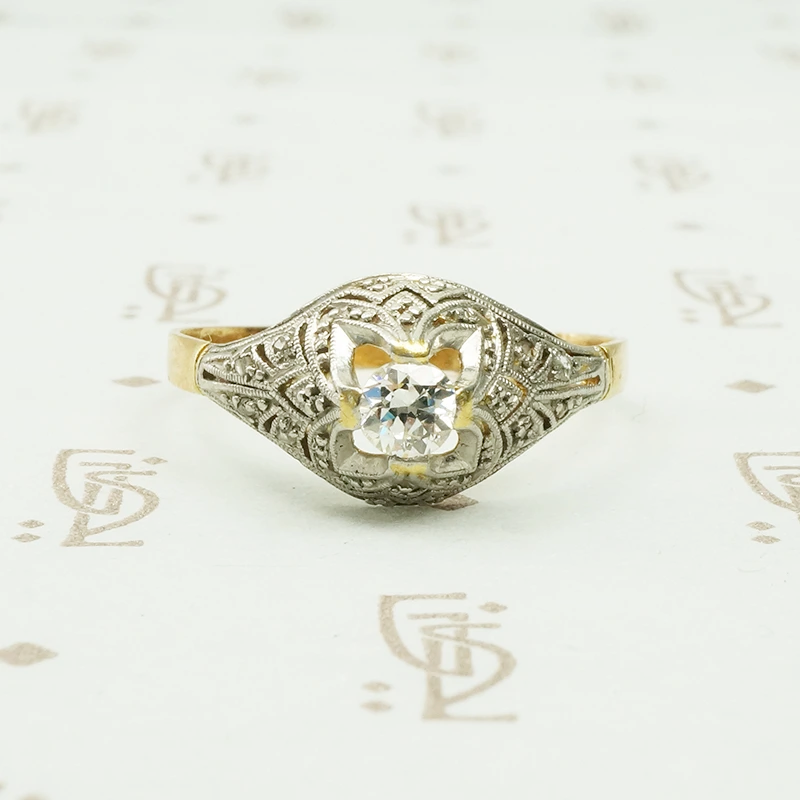platinum on 18k yellow gold with diamonds in a dome shaped ring