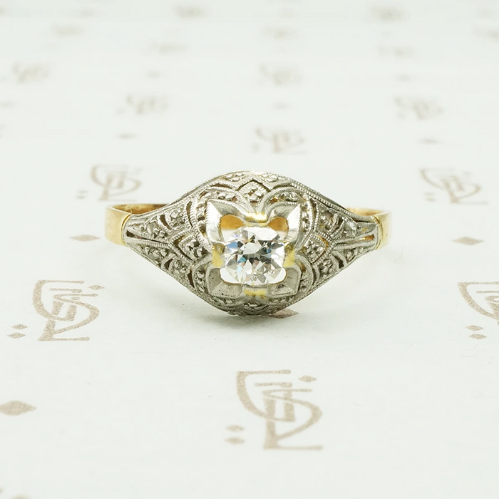 platinum on 18k yellow gold with diamonds in a dome shaped ring
