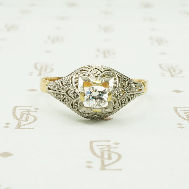 platinum on 18k yellow gold with diamonds in a dome shaped ring