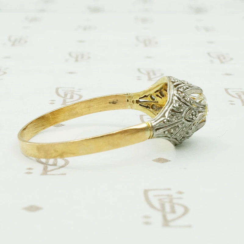platinum on 18k yellow gold with diamonds in a dome shaped ring