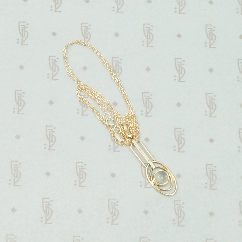 Limpid Moonstone Arts & Crafts Pendant in Gold