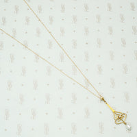 pretty 10k yellow gold edwardian lavalier pendant set with a diamond and having a river pearl dangle