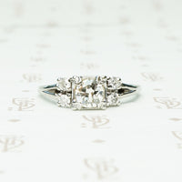 double diamond sides flank a square set round diamond in 14k white gold engagement ring