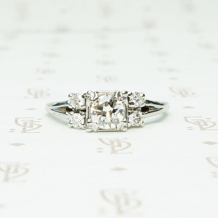 double diamond sides flank a square set round diamond in 14k white gold engagement ring