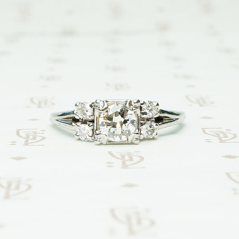 double diamond sides flank a square set round diamond in 14k white gold engagement ring