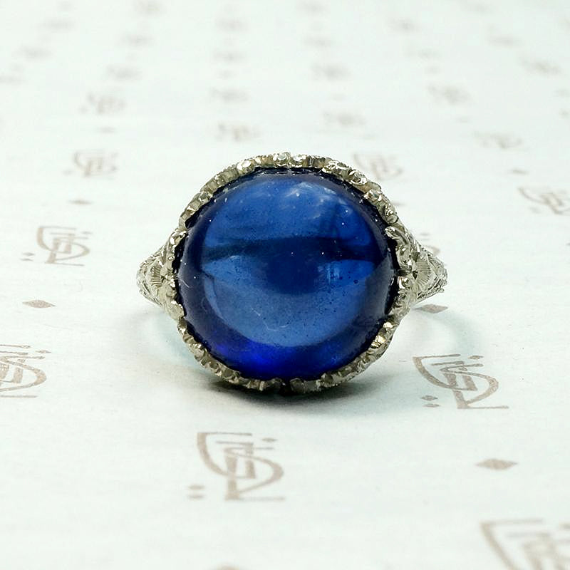 Magical Cabochon Sapphire in Crisp Floral Setting