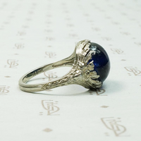 Magical Cabochon Sapphire in Crisp Floral Setting
