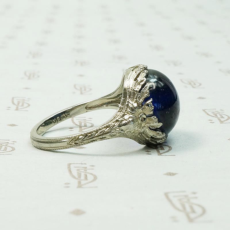 Magical Cabochon Sapphire in Crisp Floral Setting