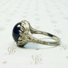 Magical Cabochon Sapphire in Crisp Floral Setting