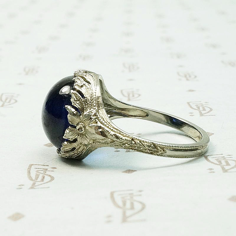 Magical Cabochon Sapphire in Crisp Floral Setting