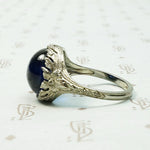 Magical Cabochon Sapphire in Crisp Floral Setting