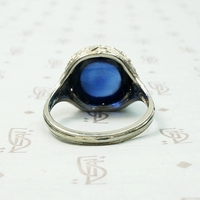 Magical Cabochon Sapphire in Crisp Floral Setting