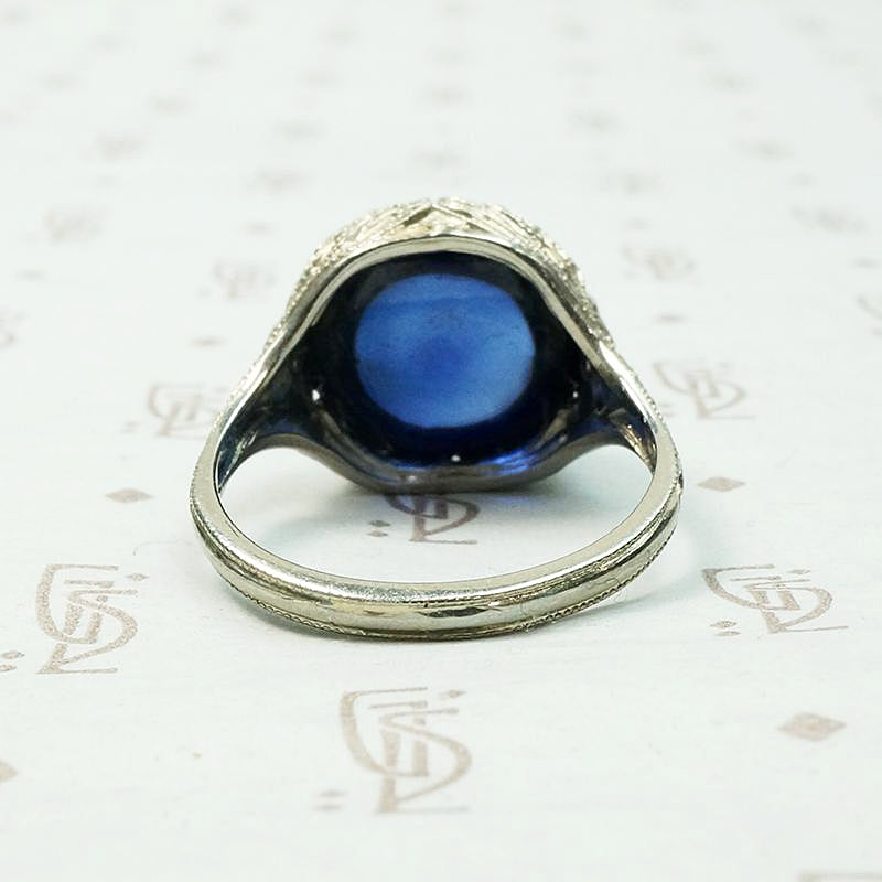 Magical Cabochon Sapphire in Crisp Floral Setting