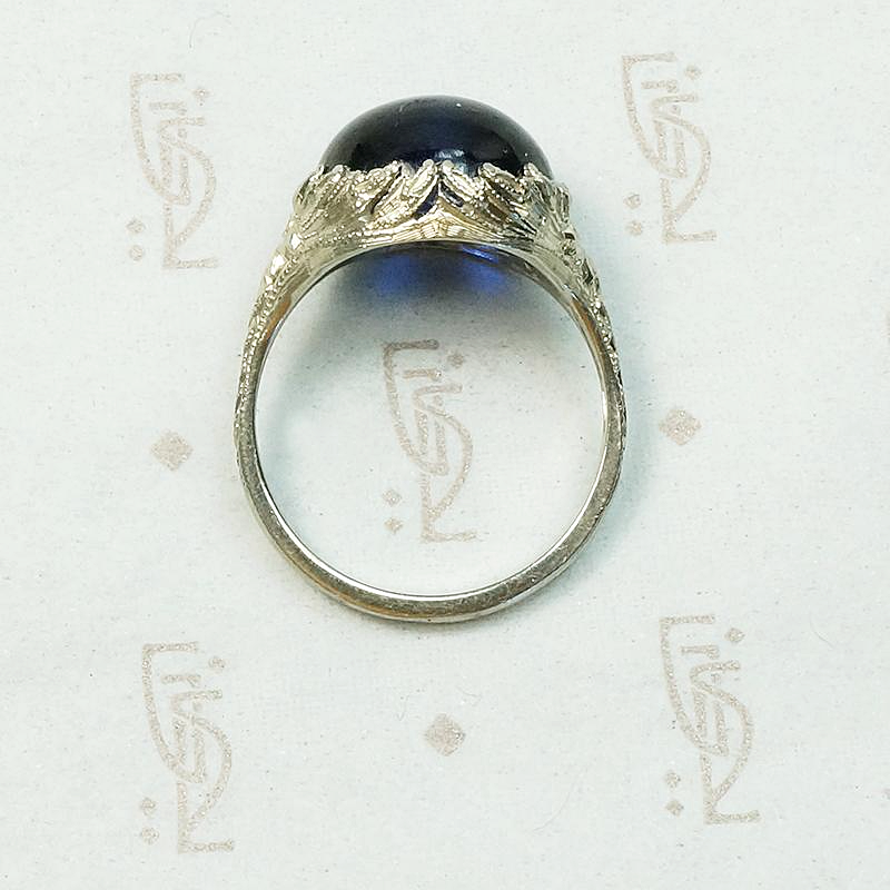 Magical Cabochon Sapphire in Crisp Floral Setting