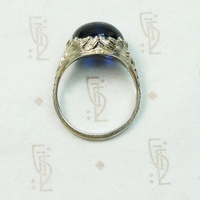 Magical Cabochon Sapphire in Crisp Floral Setting