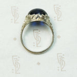 Magical Cabochon Sapphire in Crisp Floral Setting