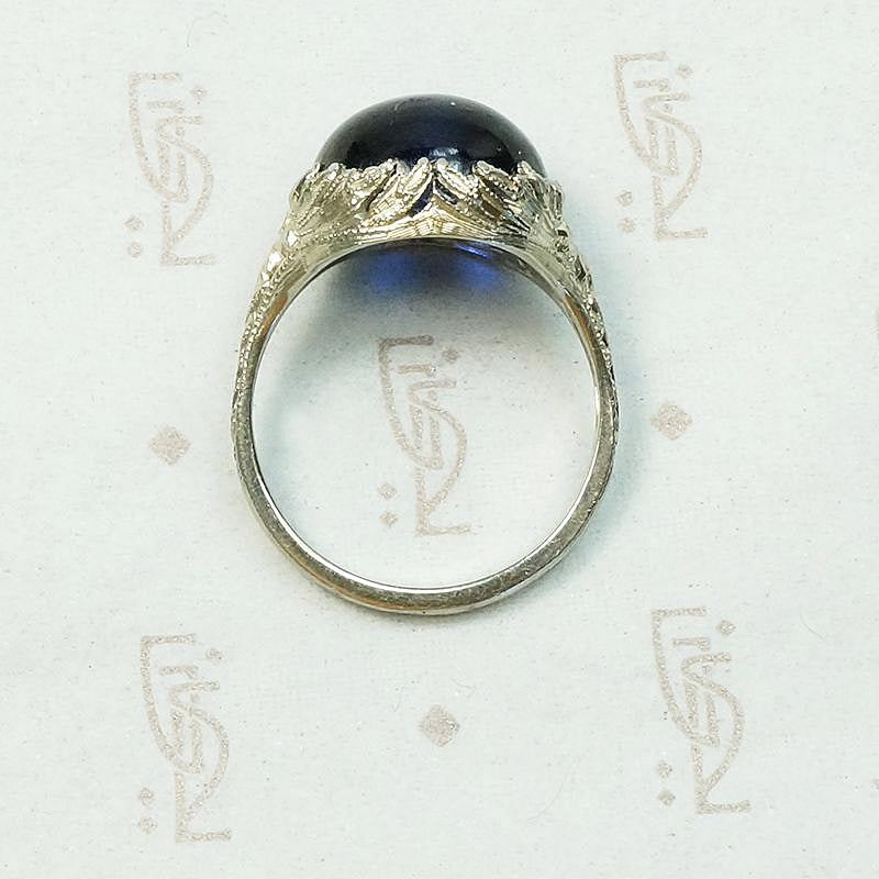 Magical Cabochon Sapphire in Crisp Floral Setting