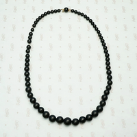 Graduated Black Matte Glass Beads with Gold Fittings