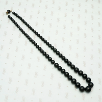 Graduated Black Matte Glass Beads with Gold Fittings
