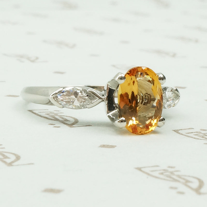 1 carat oval imperial topaz flanked by .20ct marquise diamonds in platinum intage engagement ring
