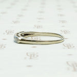 Seven Diamond White Gold Wedding Band