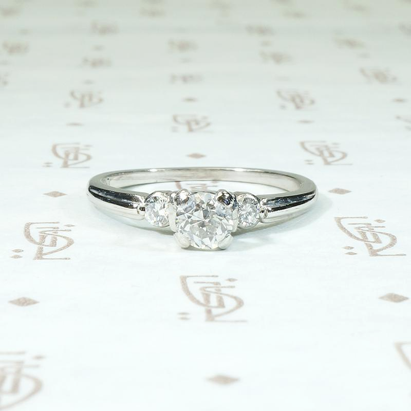 Tasteful Retro Three Stone Engagement Ring