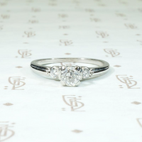 Tasteful Retro Three Stone Engagement Ring